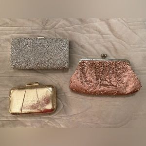 3 gold, pink, & silver clutches